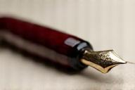 Polished un-lacquered ebonite pen blank showing natural sheen and color